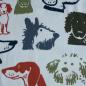 Preview: Baumwolljersey Hundeköpfe grün blau rostorange auf weiß