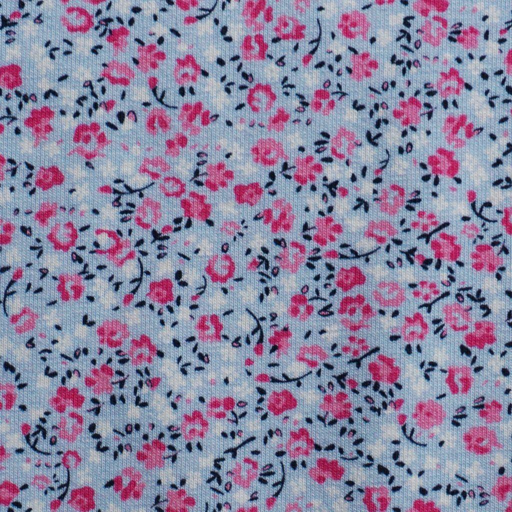 Baumwolljersey rosa Streublümchen auf blaugrau